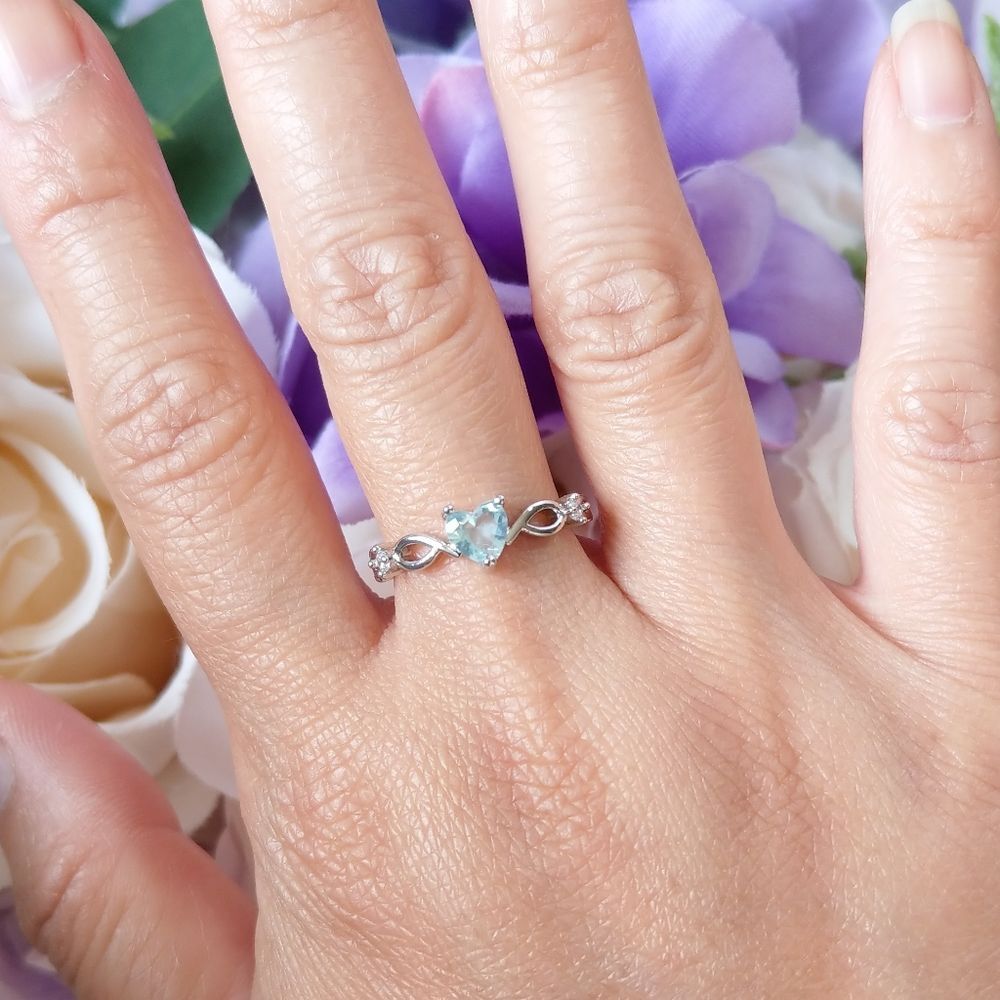 Dainty little ice blue heart ring